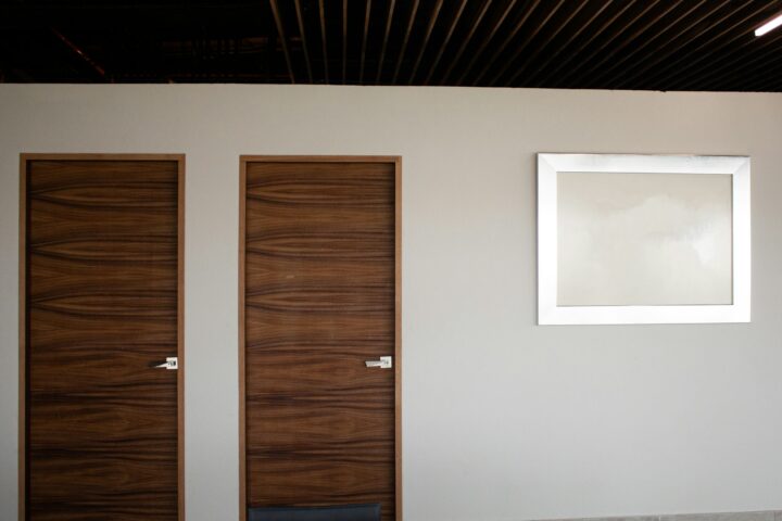 Wood interior door beside a white wall